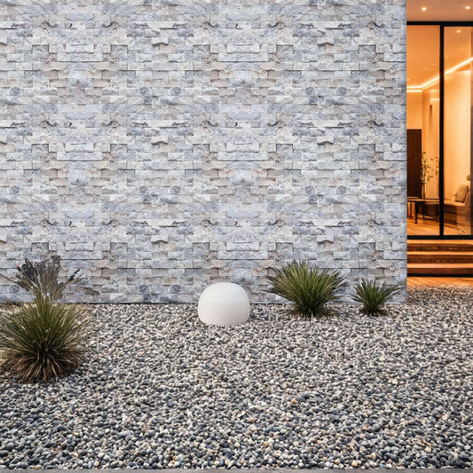 Elegant silver travertine mosaic wall design, showcasing natural stone texture in a minimalist outdoor setting.