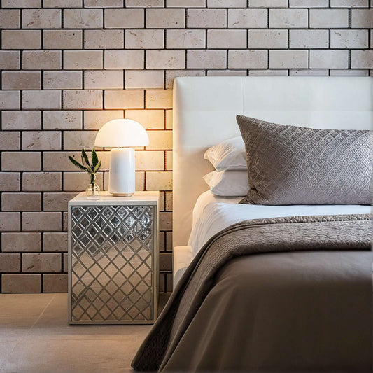 Elegant bedroom featuring travertine distressed mosaic walls, minimalist design, and polished finishes.