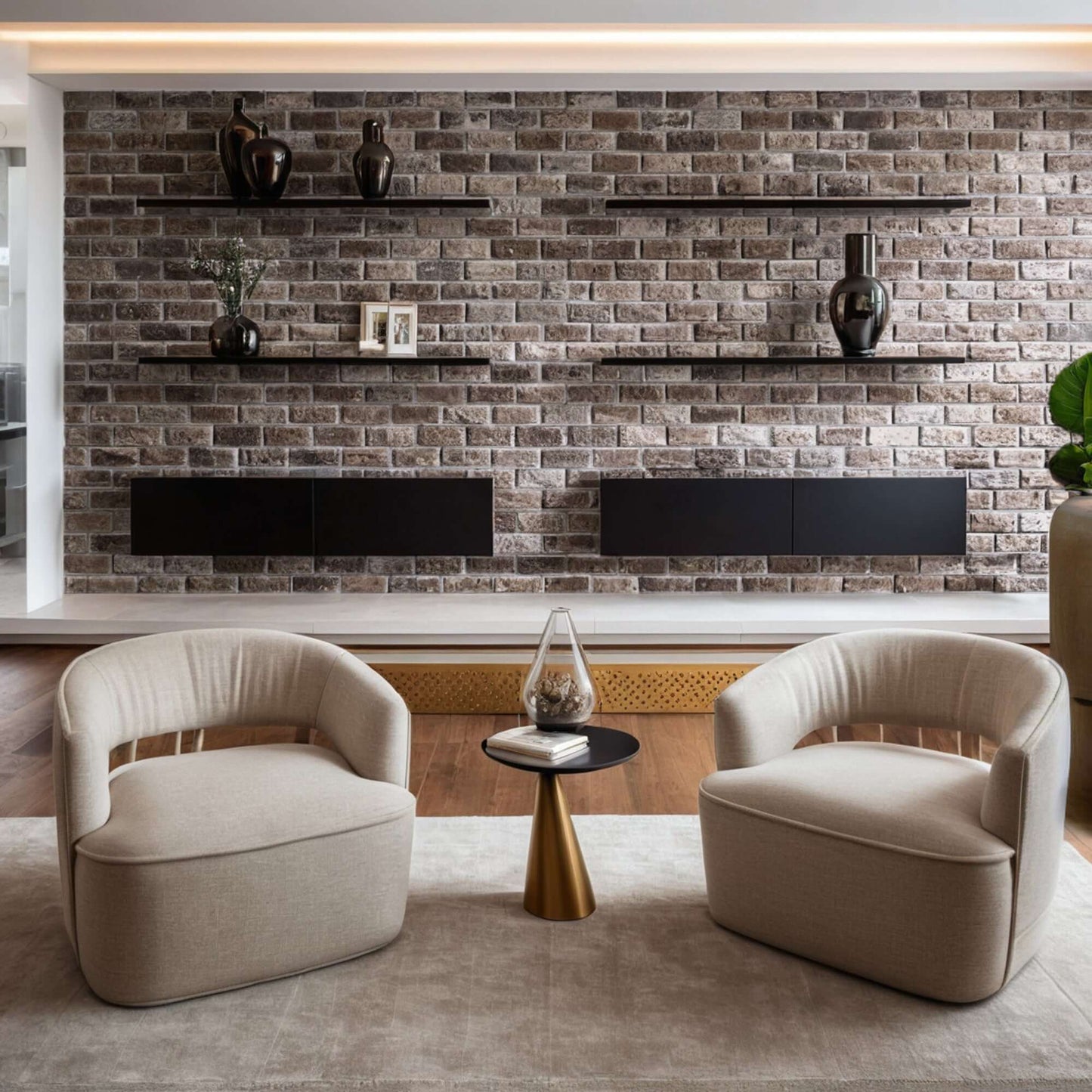 Elegant minimalist living room featuring two plush beige chairs and a stylish brick wall decor.