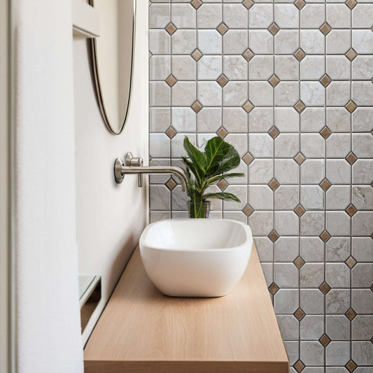 Stylish bathroom featuring a beige marble mosaic wall tile and a polished vessel sink with minimalist design.