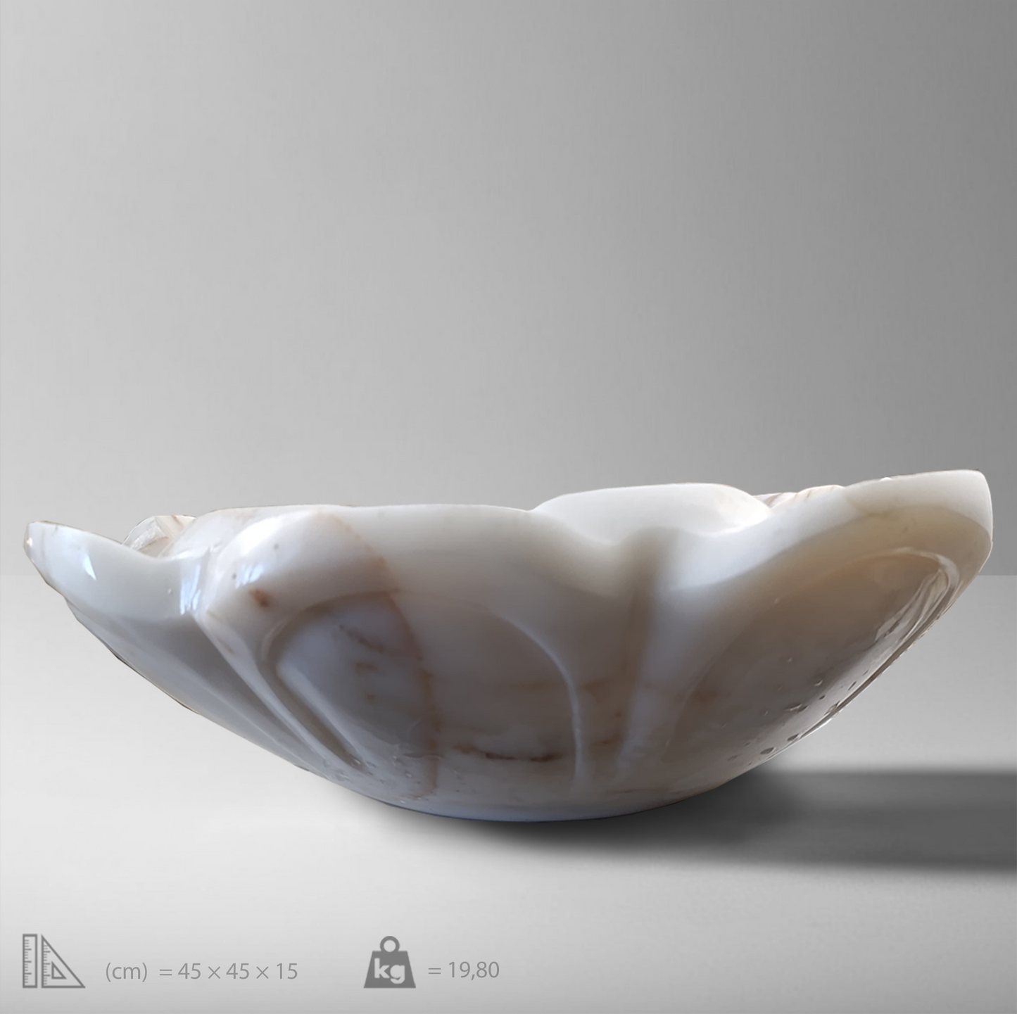 Elegant white marble flower-shaped vessel sink with polished finish, showcasing exquisite craftsmanship and minimalist design.