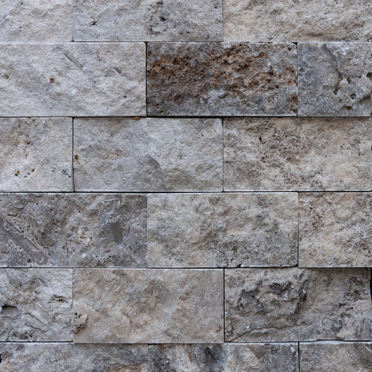Silver travertine blasted stone wall tiles, showcasing premium quality and unique texture for a timeless minimalist design.