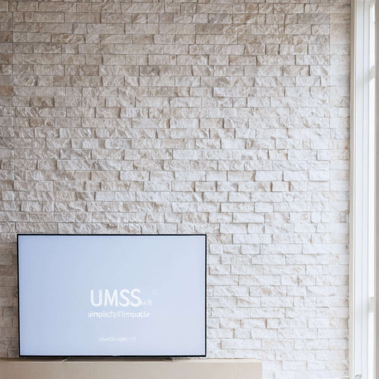 Limestone blasted mosaic wall with minimalist design and polished finish, enhancing contemporary living spaces.