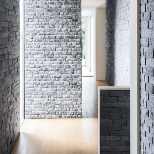 Elegant interior hallway featuring Marble Blasted Brick Mosaic walls in a minimalist design with natural stone texture.