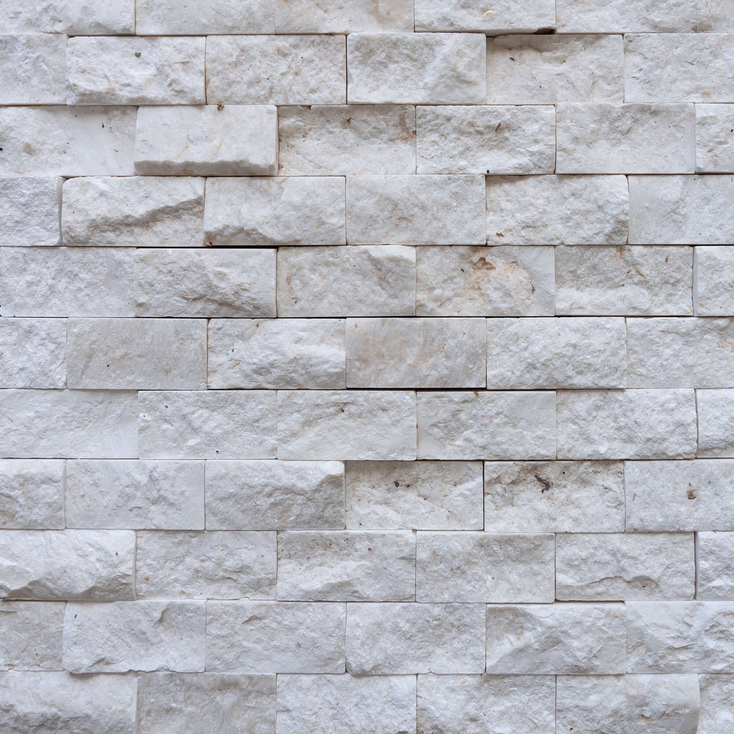 Blasted natural limestone mosaic showcasing elegant 3D texture, ideal for minimalist design and premium spaces.