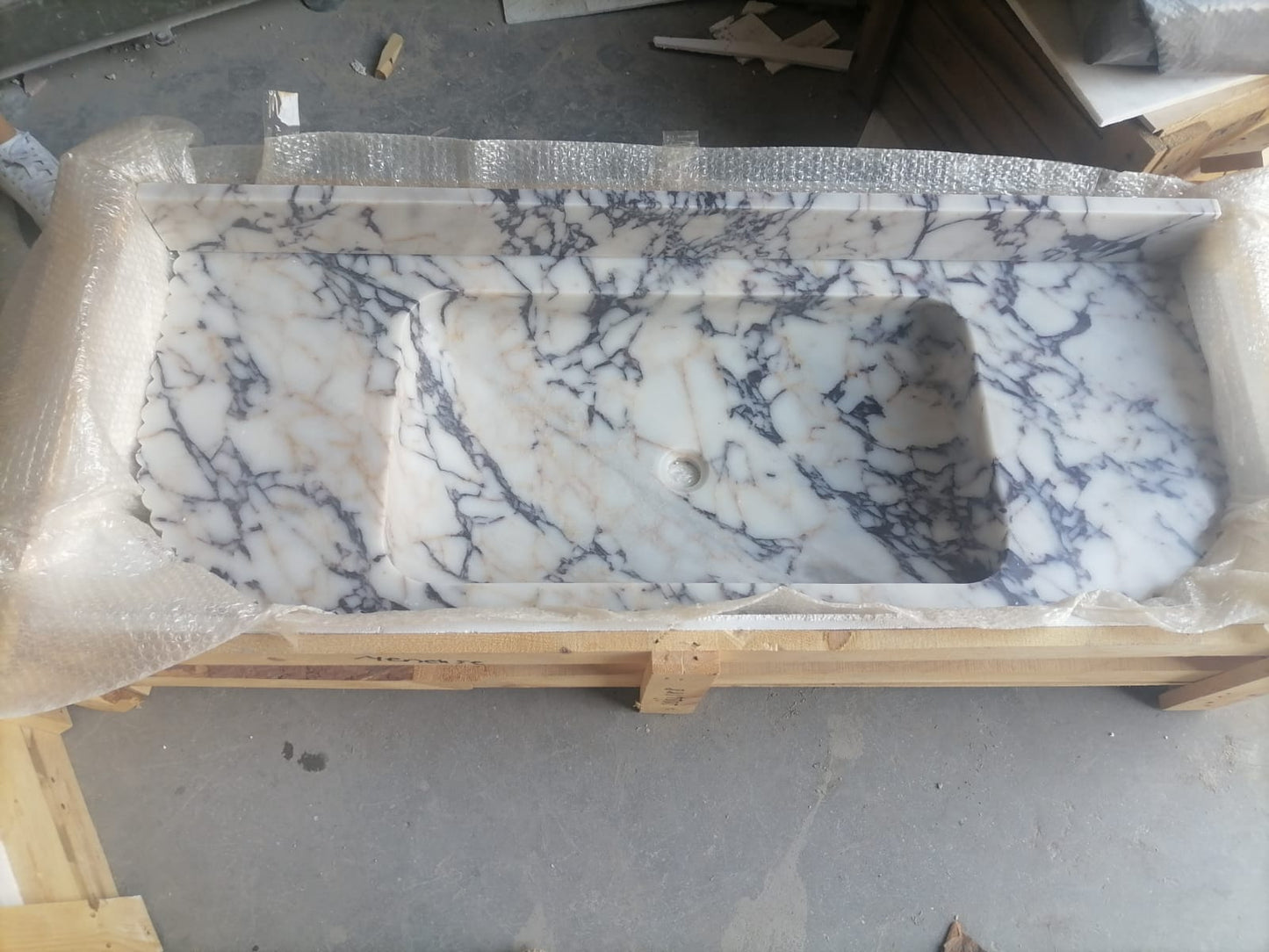 Elegant Calacatta Viola marble slab showcasing unique veining patterns and polished surface, ideal for luxurious interiors