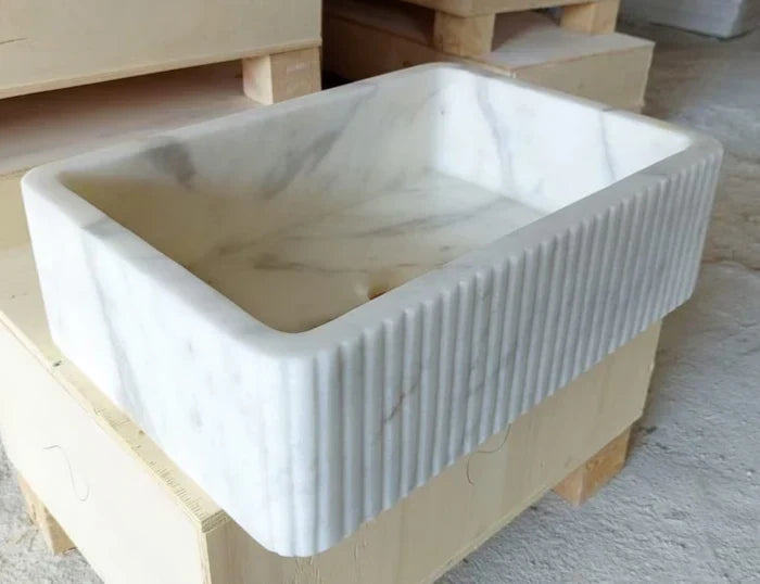 Elegant Carrara marble surface showcasing classic white and gray veining for luxurious interior designs