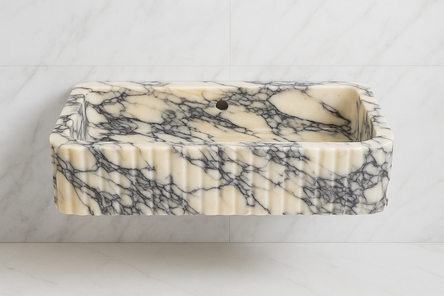 Handcrafted Calacatta Viola marble sink with bold black and white veining, perfect for luxury bathroom decor.
