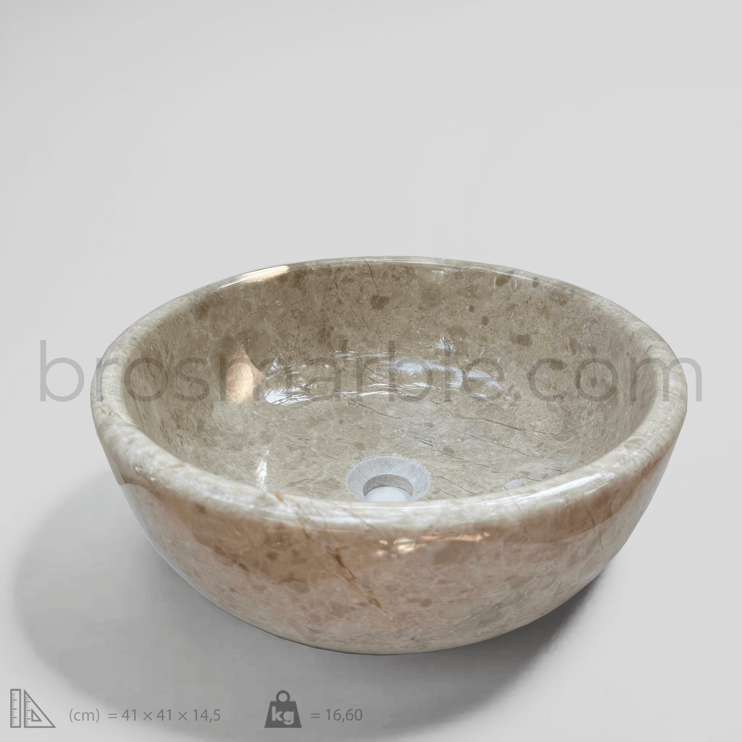 Handcrafted beige marble vessel sink with polished finish and minimalist design, showcasing natural elegance.