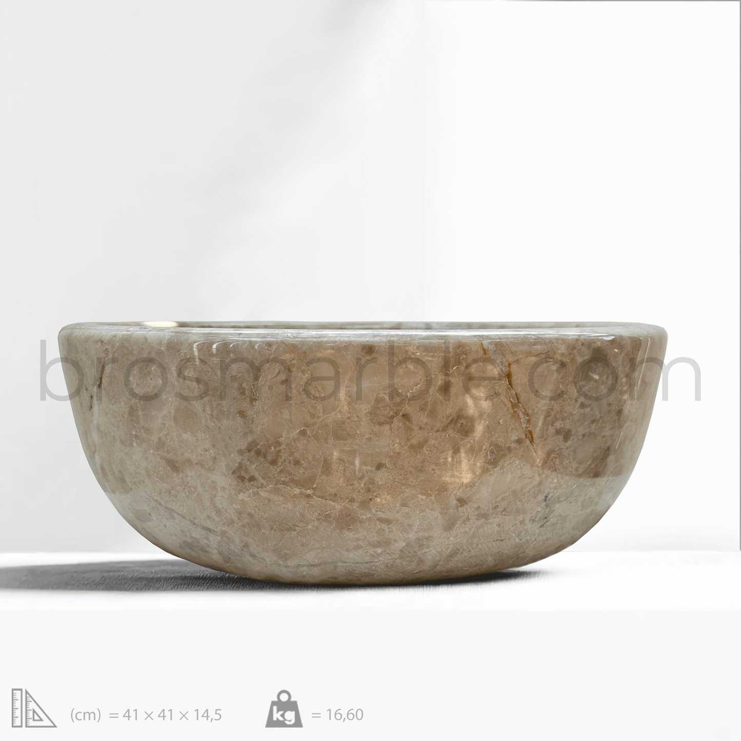 Beige marble vessel sink with polished finish showcasing minimalist design and natural stone craftsmanship.