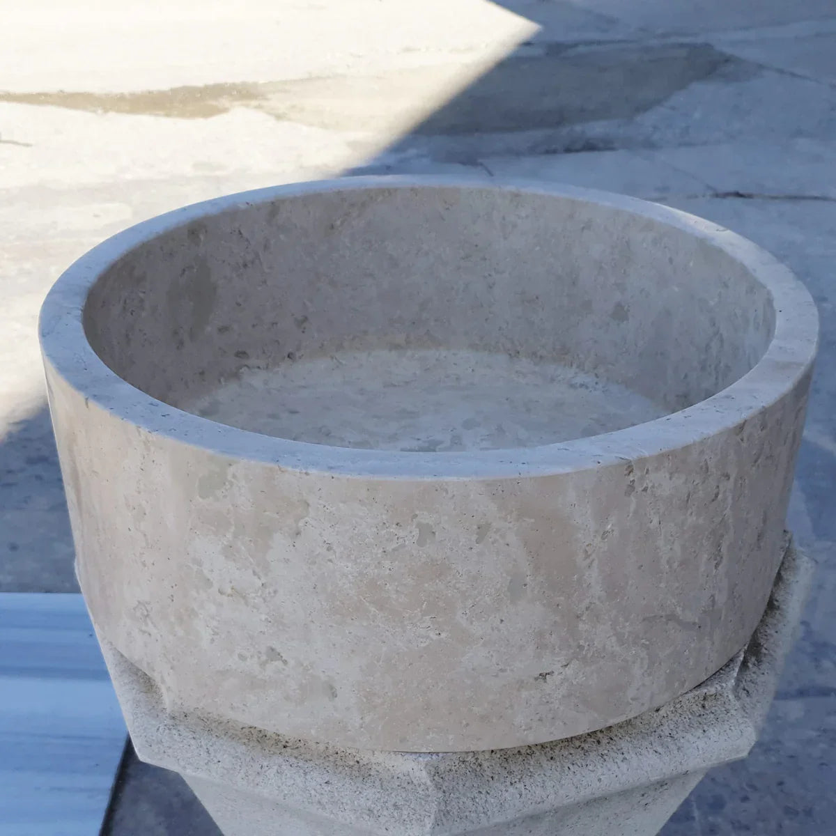 Elegant travertine sink showcasing natural stone texture for luxurious bathroom design and durability