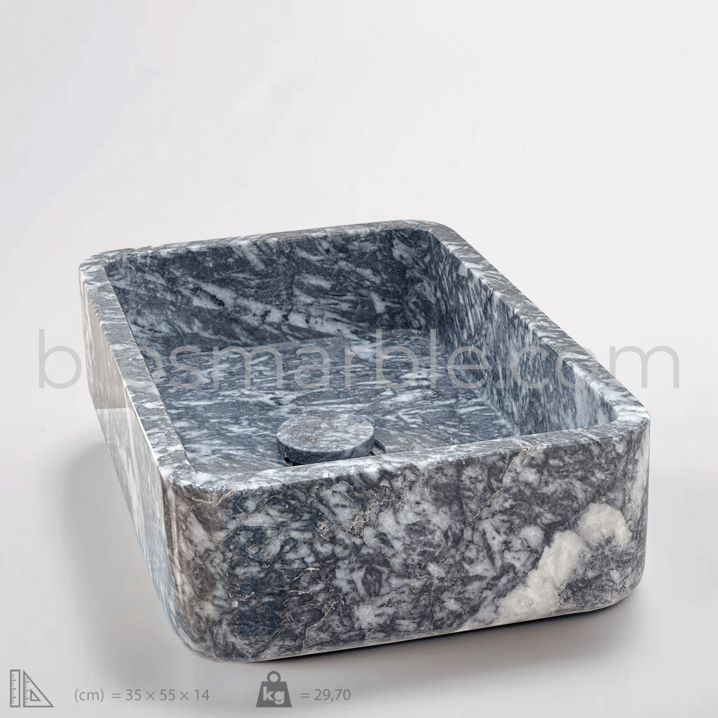 Black marble rectangular vessel sink with polished finish, showcasing minimalist design and artisan craftsmanship.
