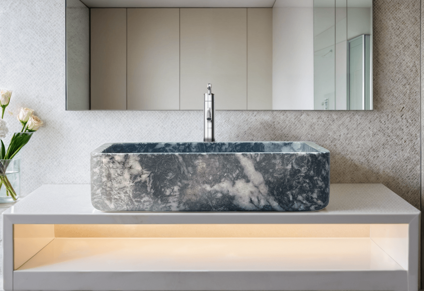 Black marble rectangular vessel sink with polished finish, showcasing minimalist design and luxurious craftsmanship in a modern bathroom.