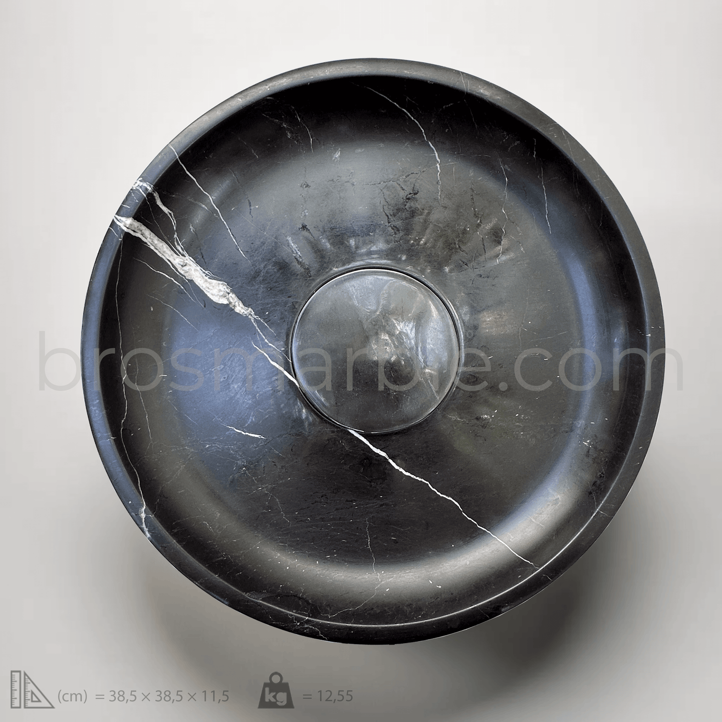 Black round marble vessel sink featuring polished finish and unique white veining for a minimalist design aesthetic.