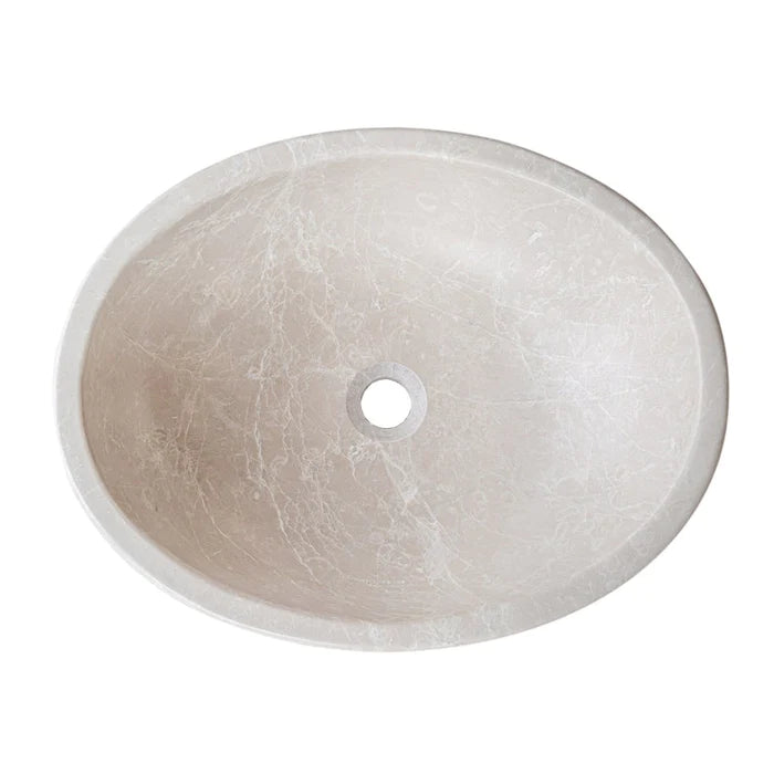 Top view of a Botticino marble vessel sink with a polished finish and minimalist design.
