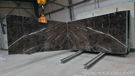 Elegant Bruno Perla design featuring luxurious brown marble surface with polished finish, perfect for upscale interiors.
