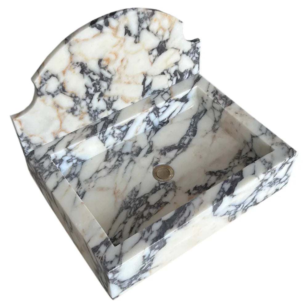 Elegant Calacatta Viola wall-mount sink showcasing luxurious marble design for modern bathrooms