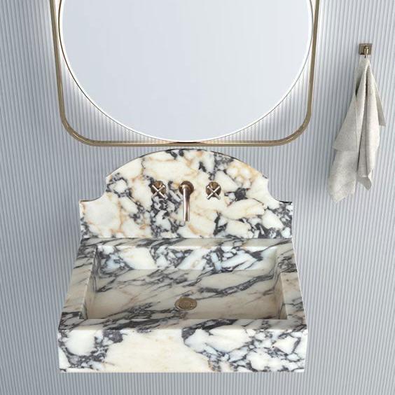 Elegant Calacatta Viola wall-mount sink showcasing luxurious marble design for modern bathrooms