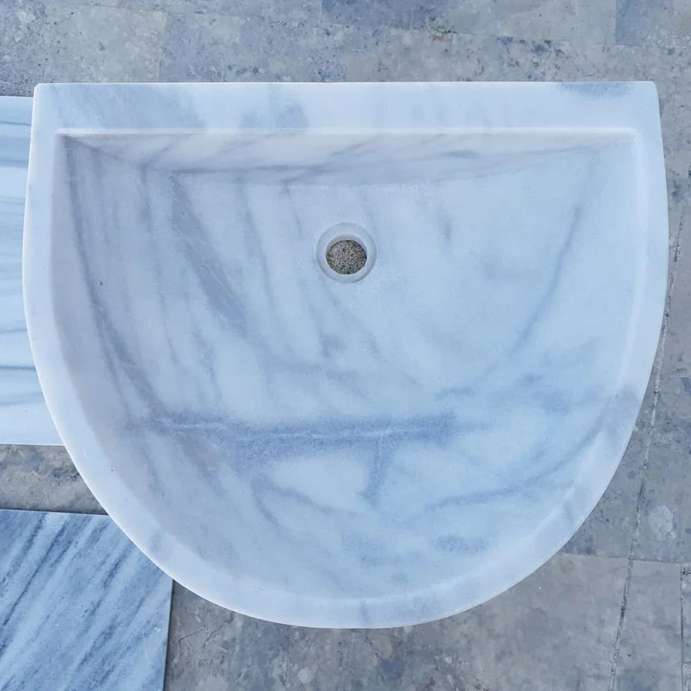Elegant Carrara White wall-mount sink showcasing modern bathroom design and space-saving functionality
