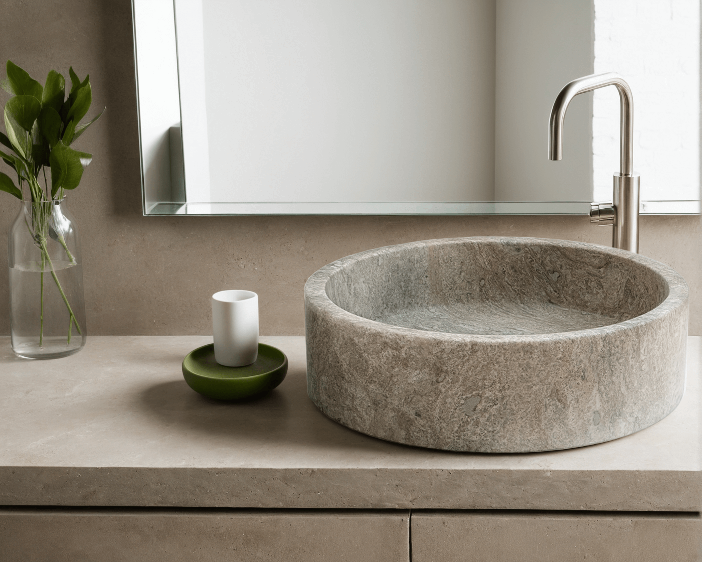Dark travertine vessel sink showcasing polished finish and minimalist design, complemented by clean bathroom aesthetics.