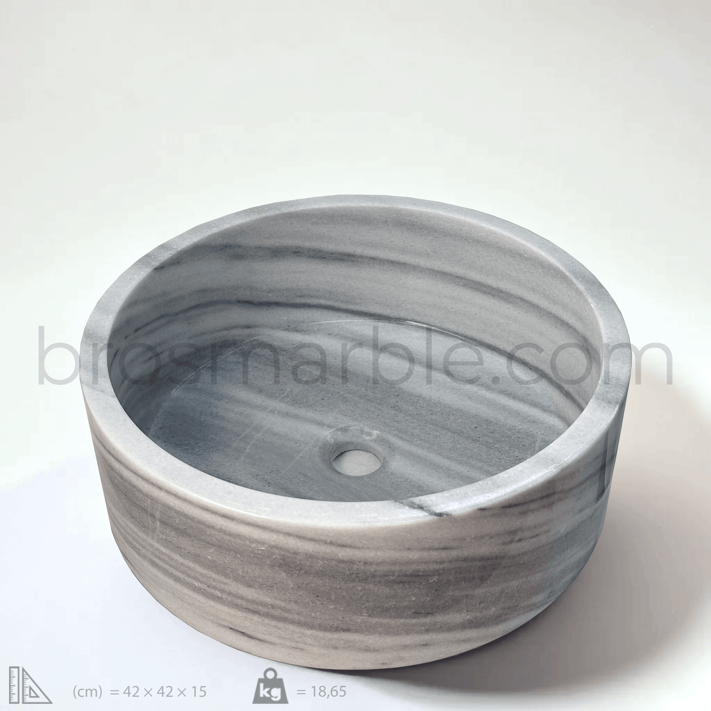 Gray marble cylindrical vessel sink with polished finish, showcasing elegant veining and minimalist design.