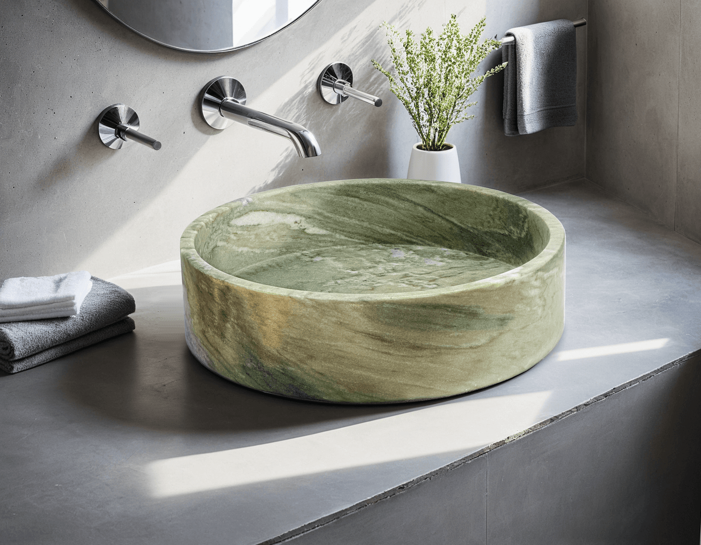 Handcrafted green marble vessel sink with polished finish, showcasing minimalist design and rich natural hues.