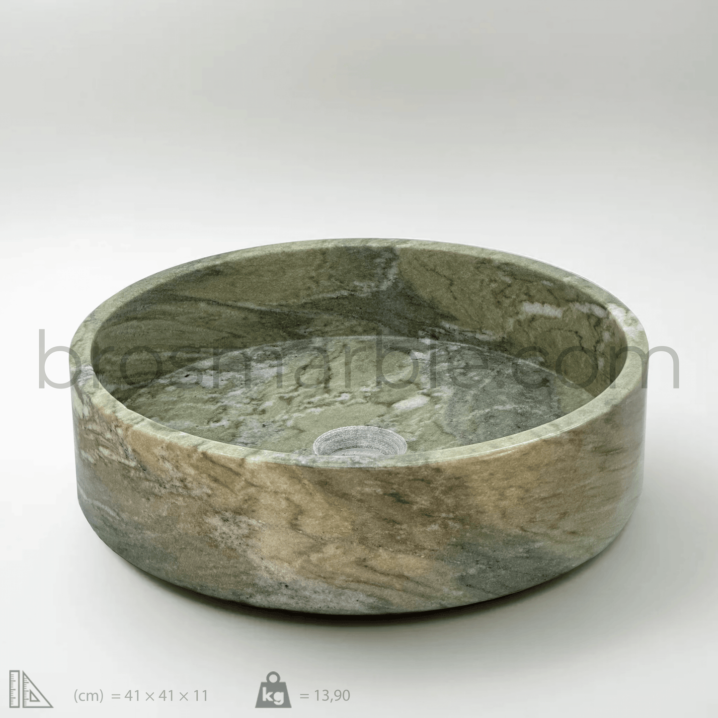 Handcrafted green marble vessel sink with polished finish and minimalist design, showcasing natural stone beauty.