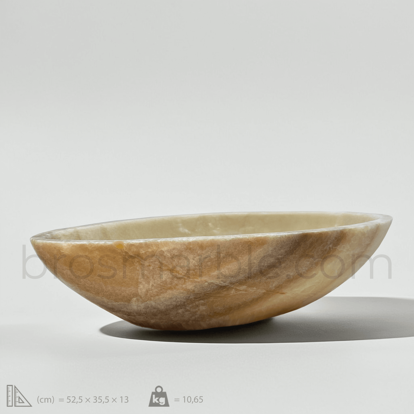 Honey Onyx marble vessel sink with polished finish, showcasing premium craftsmanship and minimalist design.