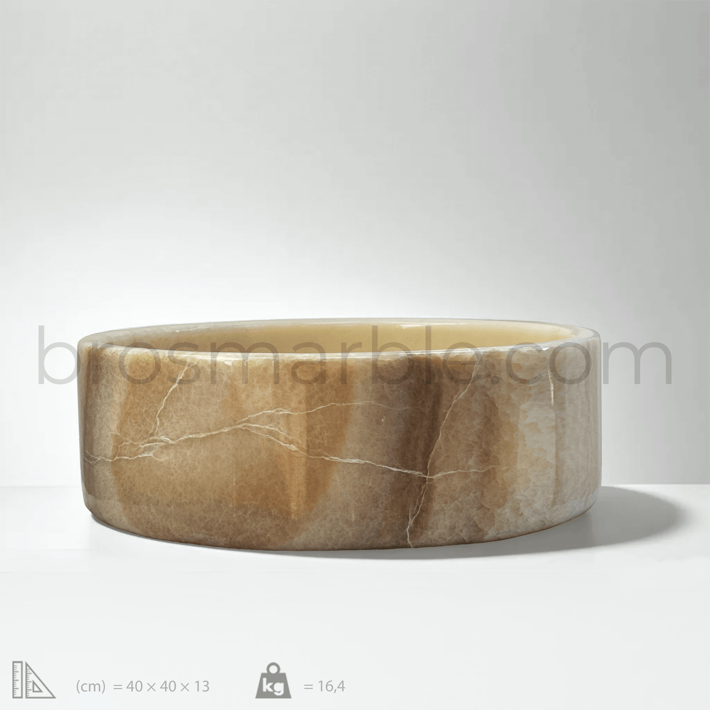 Honey Onyx Marble vessel sink with polished finish, showcasing minimalist design and unique stone veining.