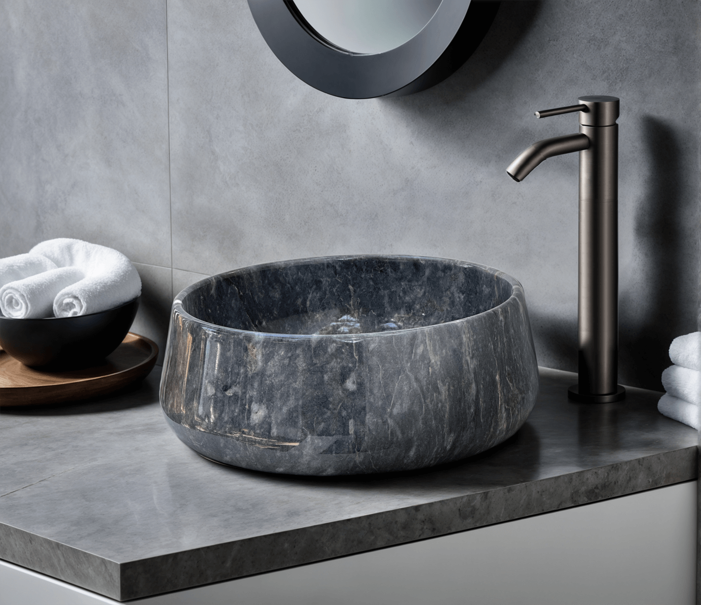 Blue marble vessel sink with polished finish, showcasing minimalist design and natural stone craftsmanship in a modern bathroom.