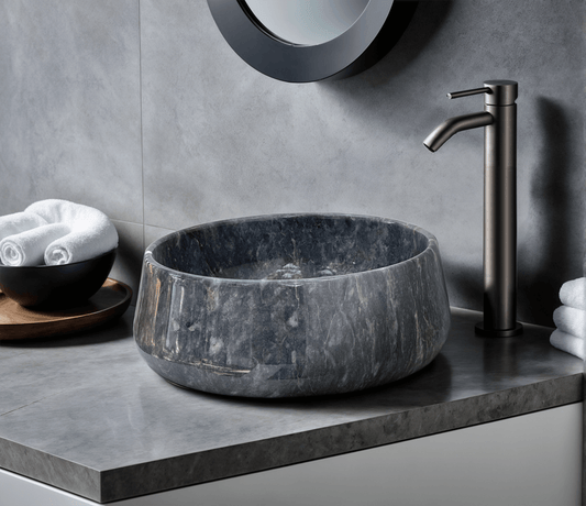 Blue Marble Vessel Sink ā carved from a single block of natural stone, no two pieces alike