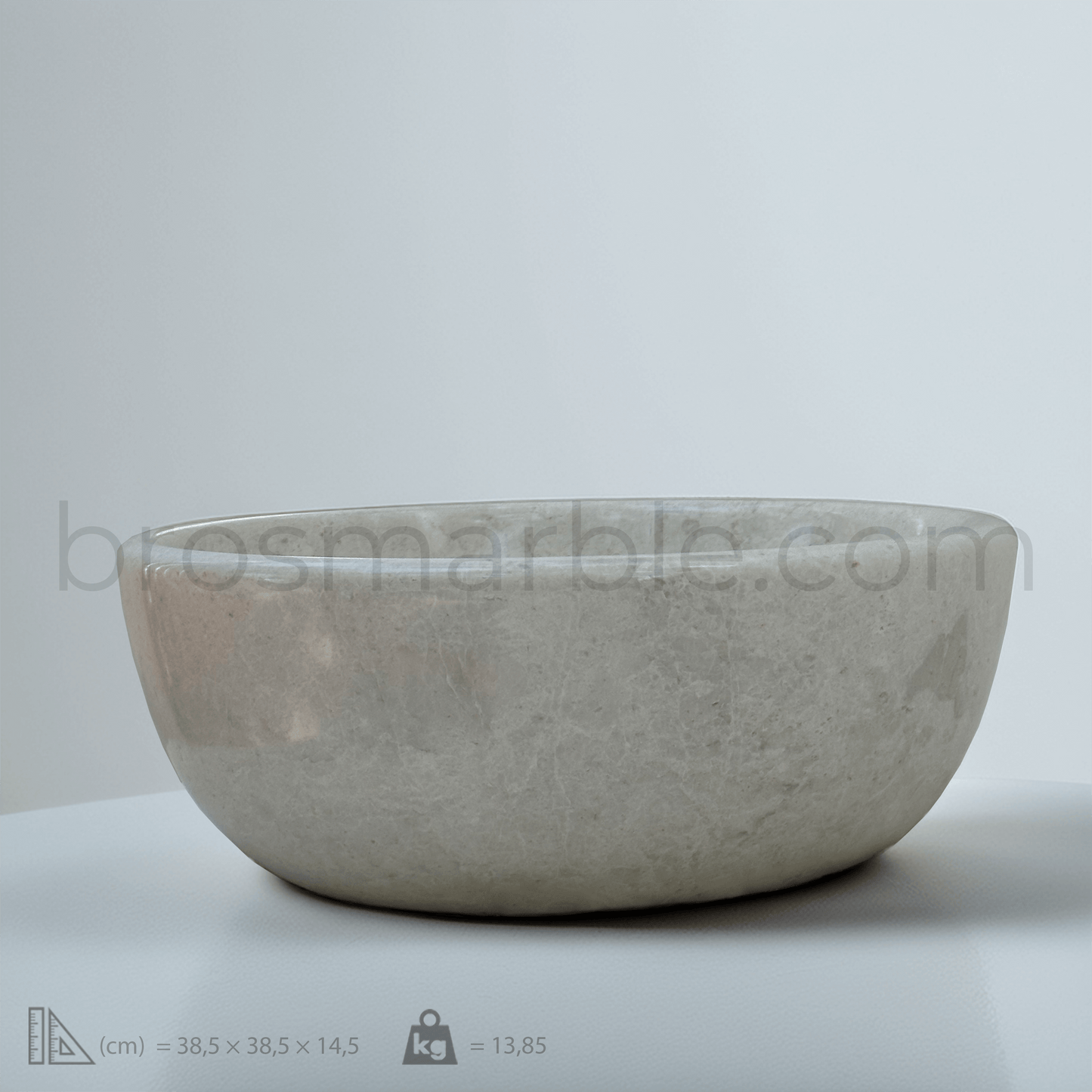 Elegant beige marble sink showcasing natural stone texture for a sophisticated bathroom design.