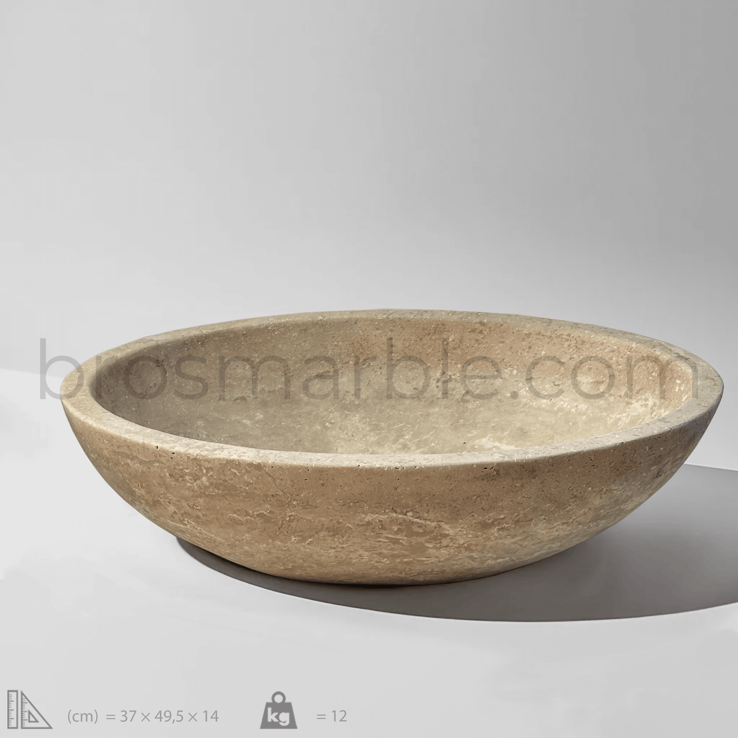 Oval travertine vessel sink with polished finish, showcasing natural stone's elegance and minimalist design.
