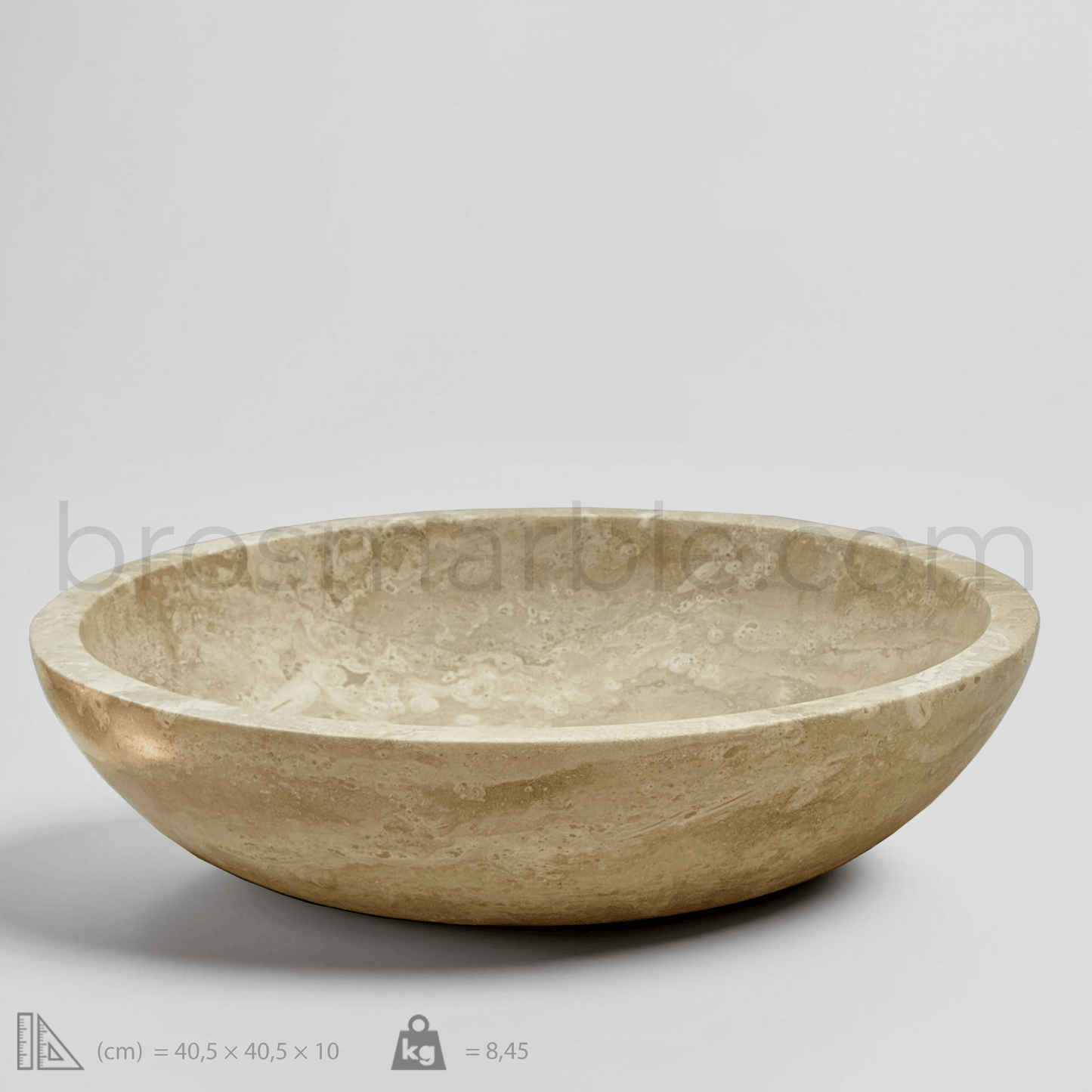 Light travertine round vessel sink with polished finish, showcasing minimalist design and organic veining.