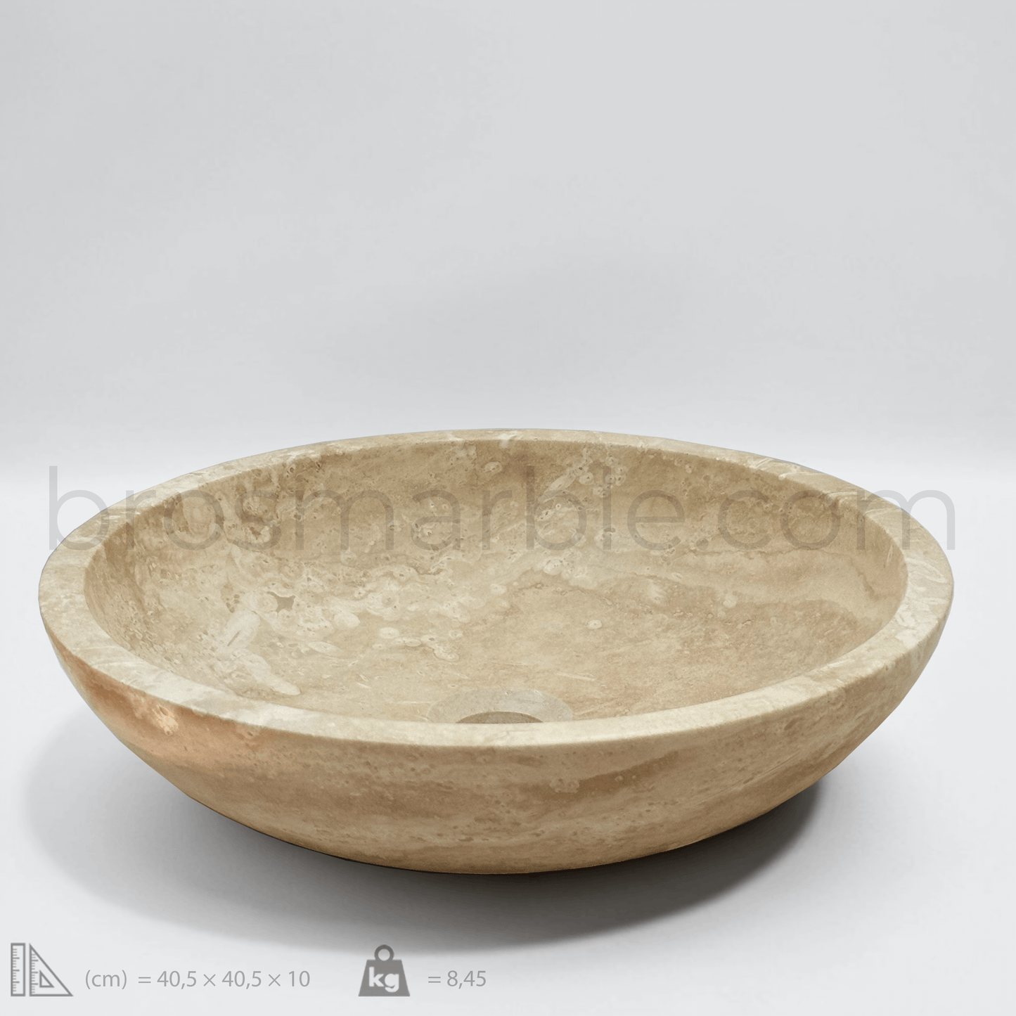 Light travertine round vessel sink with polished finish, showcasing minimalist design and natural stone craftsmanship.