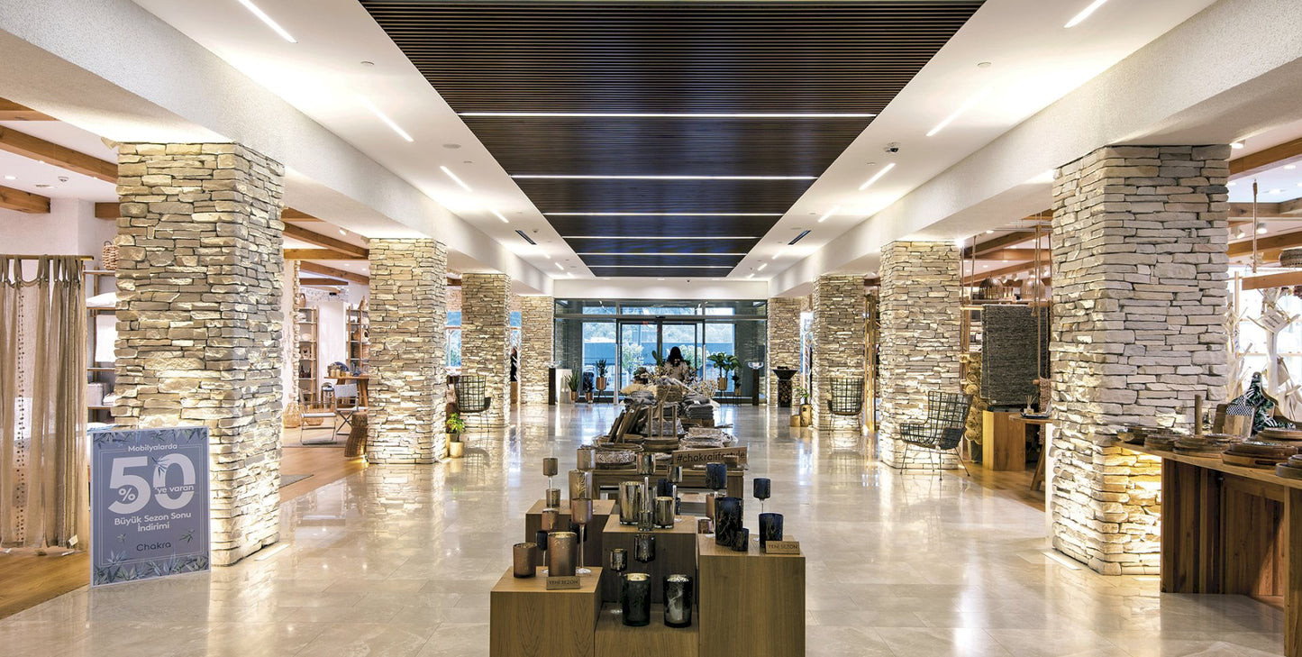 Sierra Pearl manufactured stone exterior wall showcasing natural texture and durability