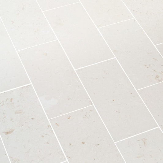 Elegant limestone tile flooring showcasing natural texture and durability, ideal for sophisticated interior designs.