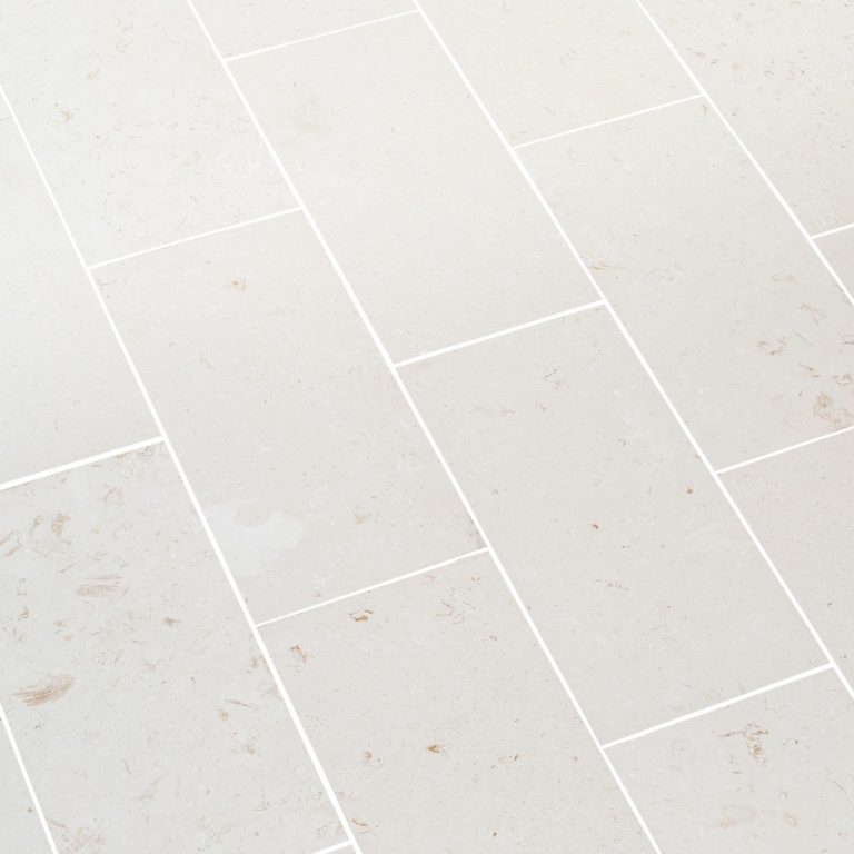 Close-up of durable white limestone surface showcasing natural texture and strength for construction use