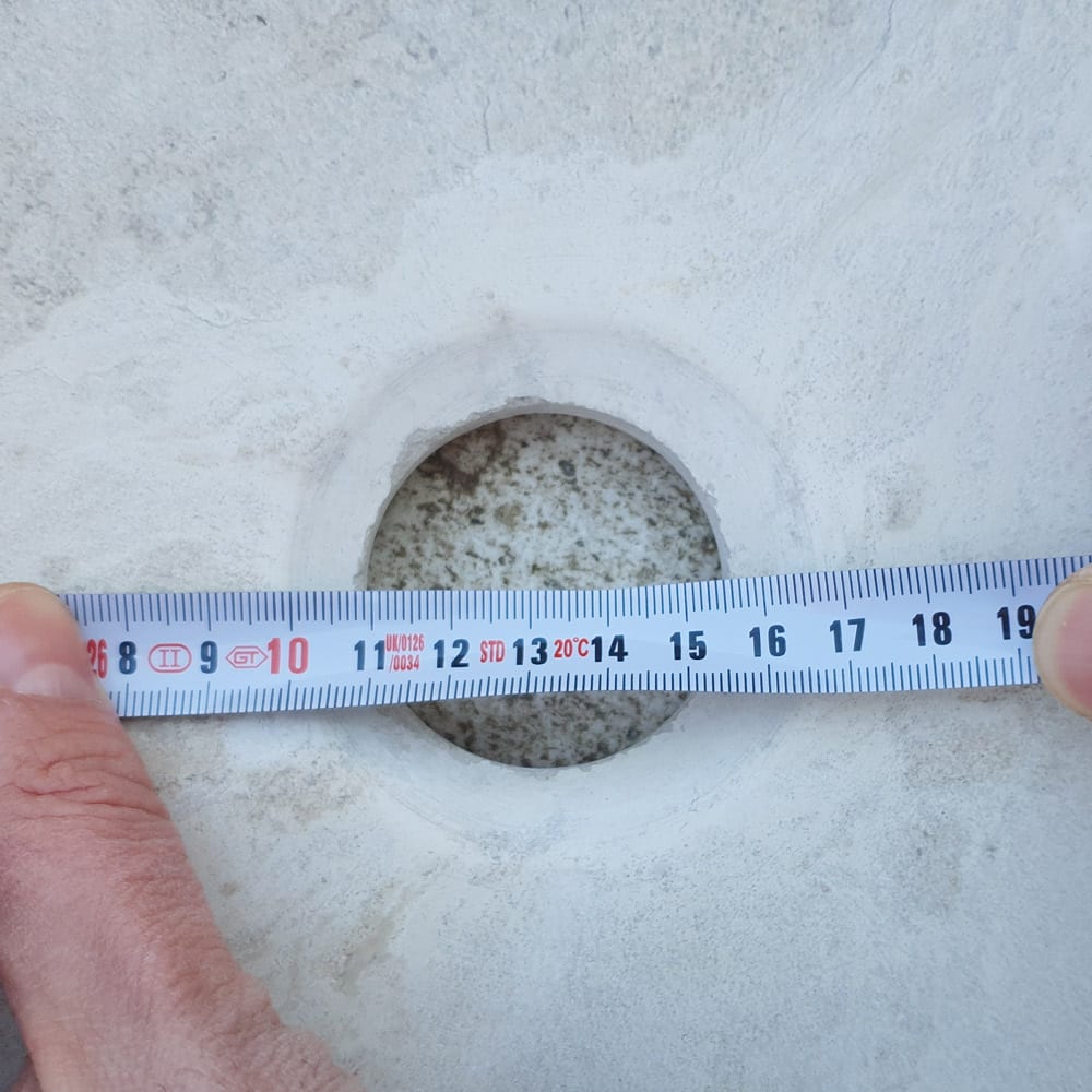 Elegant limestone vessel sink showcasing natural stone texture, perfect for modern bathroom designs