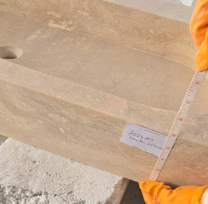 Elegant travertine bathroom sink showcasing natural stone textures for a luxurious and durable bathroom design.