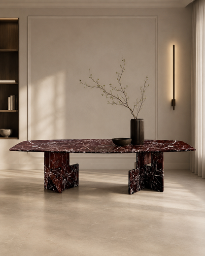 Cherry Red marble dining table in a contemporary dining room with a linear wall light