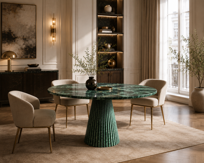 Verde Guatemala green marble round dining table seen from the side in a panelled interior