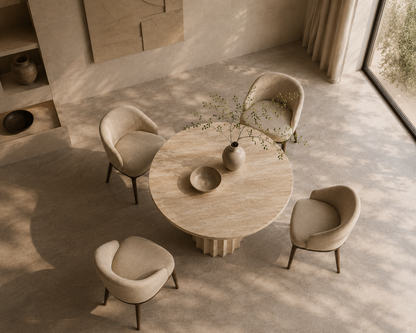 Bros Arizona travertine round dining table seen from above, showing the honed beige surface
