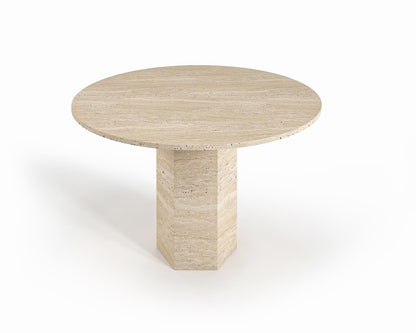 Nevada travertine round dining table, studio view of the round top on a geometric stone pedestal