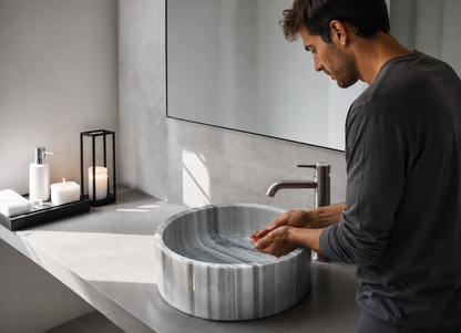 Gray Marmara Cylinder Vessel Sink in natural marble — shown installed on a bathroom vanity