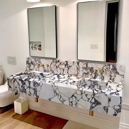 Elegant bathroom countertop featuring Calacatta Viola marble with a stylish double sink design