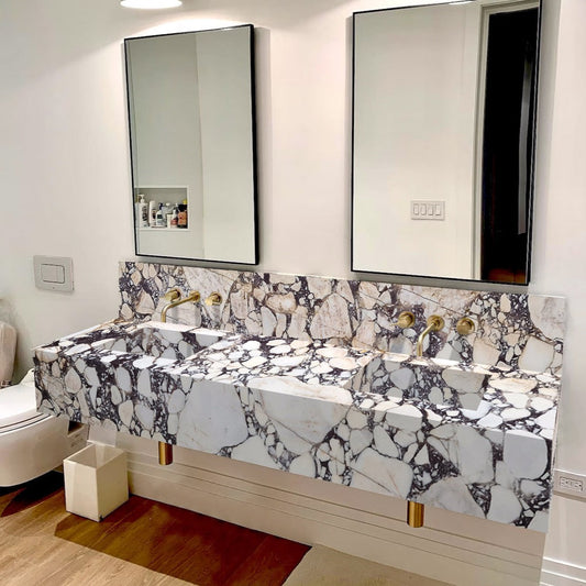 Elegant bathroom countertop featuring Calacatta Viola marble with a stylish double sink design