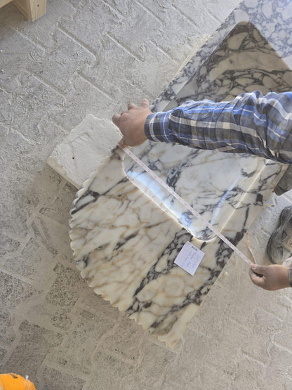Elegant Calacatta Viola marble slab showcasing unique veining patterns and polished surface, ideal for luxurious interiors