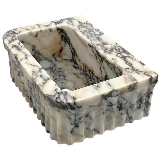 Elegant Calacatta Viola vanity sink showcasing luxurious marble veining for sophisticated bathroom design