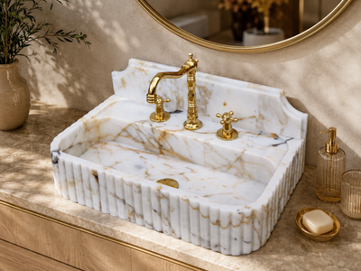 Calacatta Gold Wall-Mount Sink in natural marble — carved from a single block of natural stone, no two pieces alike